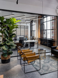 Spotlessly clean and organized office space in Charlotte, NC, impeccably maintained by Maidfully, showcasing shiny desks, polished floors, and crystal-clear windows.