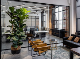 Spotlessly clean and organized office space in Charlotte, NC, impeccably maintained by Maidfully, showcasing shiny desks, polished floors, and crystal-clear windows.